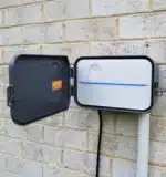 rachio outdoor enclosure open door with conduit