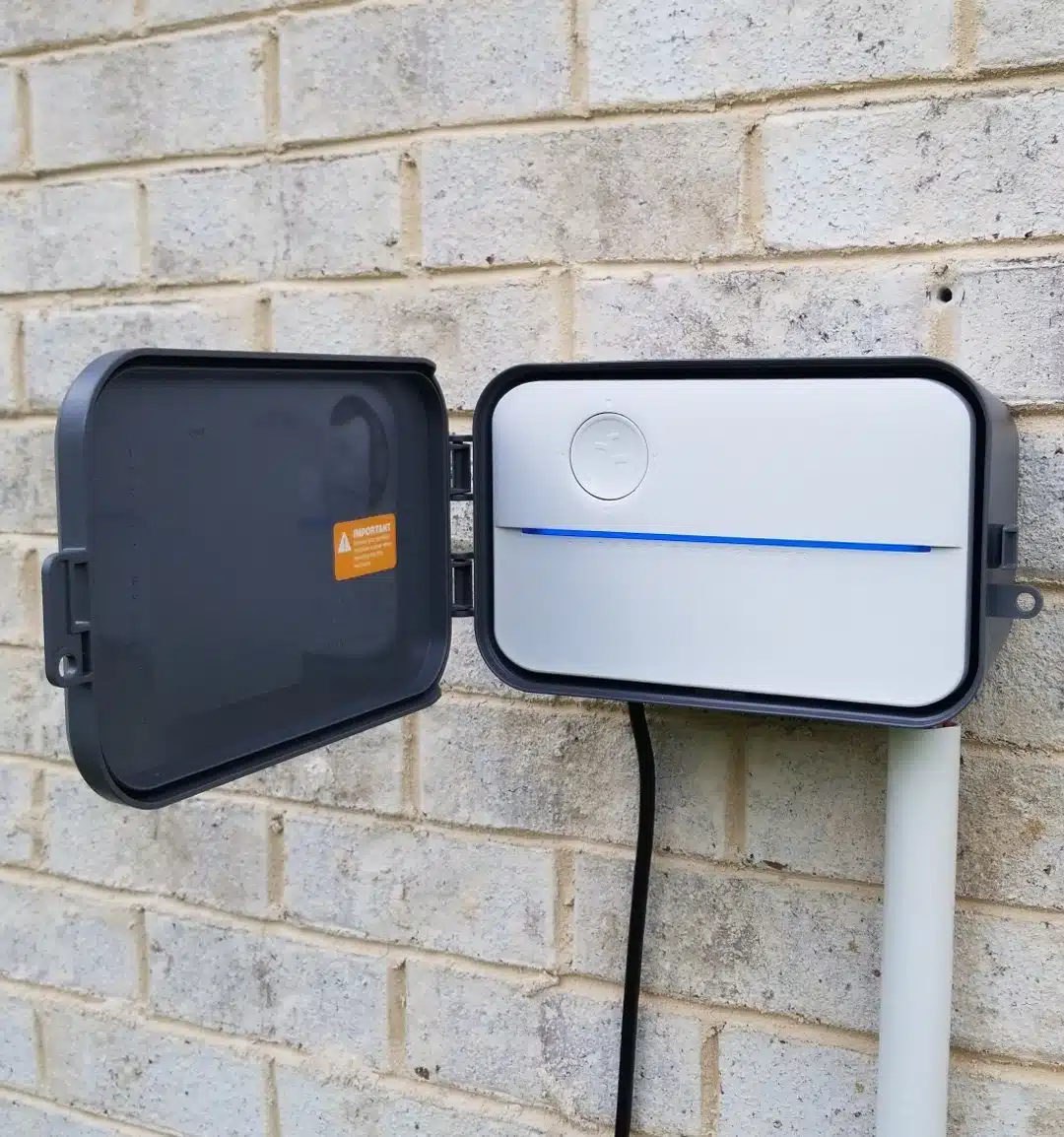 rachio outdoor enclosure open door with conduit